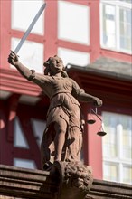 Justitia with scales and sword