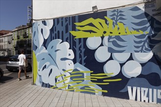 Decorative mural with leaves and grapes