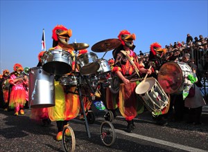 Musicians in fantasy costumes at the street parade in Menton