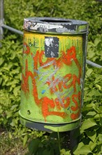 Colourfully painted metal wastepaper basket