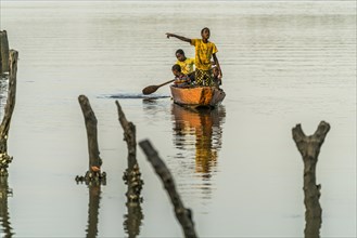 Children on a pirogue on the Gambia River
