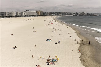 Sandy beach beach on the Atlantic Ocean with few bathers