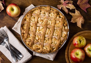 Top view apple pie thanksgiving with cutlery leaves