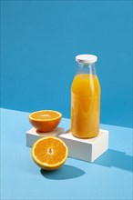 High angle orange juice bottle
