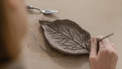Close up hand making leaf