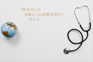 Stethoscope globe with word environment day text