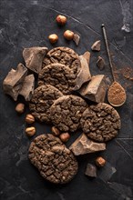 Top view chocolate cookies with hazelnuts cocoa powder