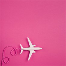 Toy plane with pink lace