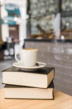 Cup coffee books wooden table