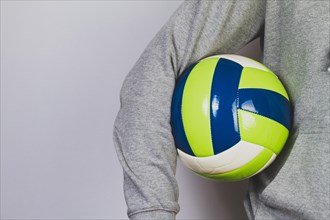 Person holding ball with his arm