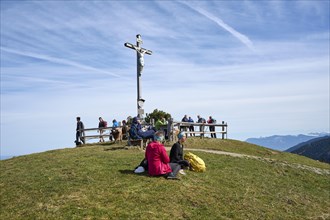 Hikers resting on the summit of Schwarzenberg