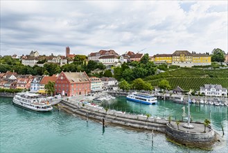 Town view of Meersburg on Lake Constance with landing stage and excursion boats