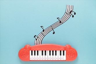 Top view piano toy with blue background