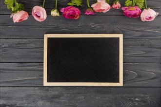 Rose flowers with big chalkboard wooden table