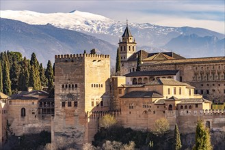 View from the Mirador de San Nicolas of Alhambra and the snow-capped mountains of the Sierra Nevada