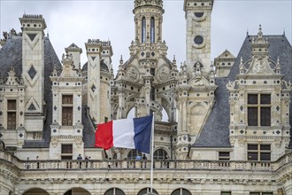 French flag in front of Chambord Castle in the Loire Valley