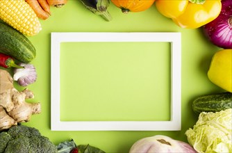 Top view empty frame with arrangement vegetables