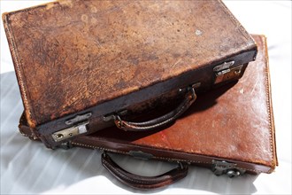 Two old leather suitcases with many traces of use