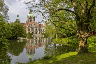New Town Hall with reflection in the water at the Maschteich in the Maschpark