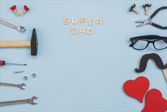 Super dad inscription with tools glasses