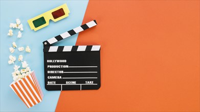 Clapperboard with 3d glasses popcorn