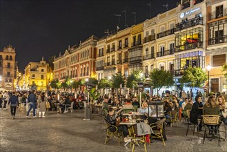 Crowded restaurants and bars in Plaza de San Francisco square at night