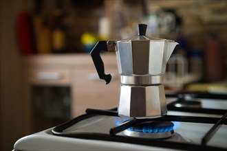 Metal coffee mocha pot on a gas stove