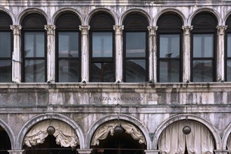 Close frontal shot of facade of Procurate Vecchie building in St Mark's square or piazza San Marco