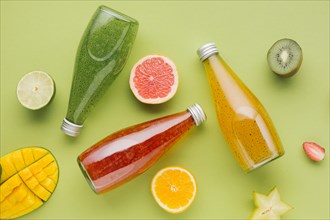 Colorful juice bottles fruit slices