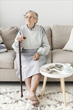 Portrait elderly grandmother sitting sofa