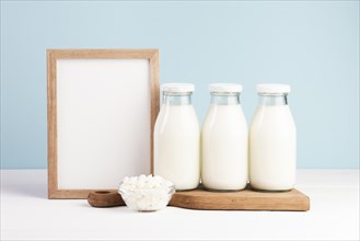 Wooden frame with bottles milk