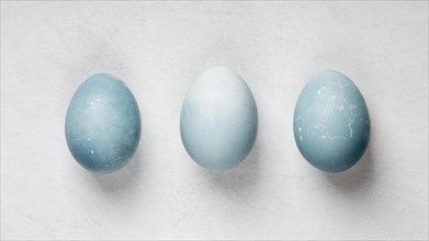 Flat lay three easter eggs
