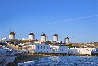 Beautiful view of famous traditional white windmills on top of hill