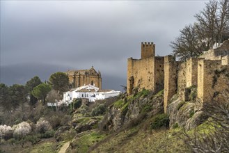 Medieval city walls Murallas de Ronda and the church Iglesia del Espiritu Santo