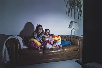 Girls enjoying movie dark room