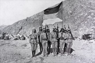 Flag of Hejaz Kingdom carried by soldiers