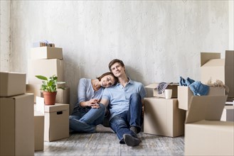Romantic couple enjoying they home while packing move out