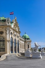The Austrian flag flies over the upper baroque palace Belvedere
