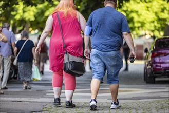 Man and woman with overweight