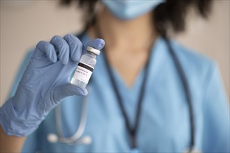 Female doctor preparing vaccine patient