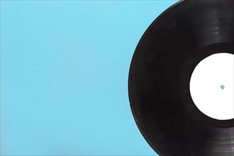 Single circular vinyl record blue background