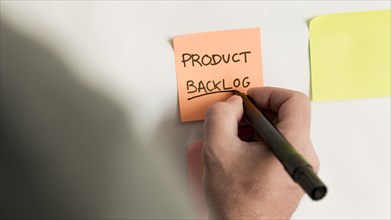 Close up sticky note with product backlog