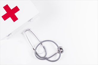 First aid kit with stethoscope white background