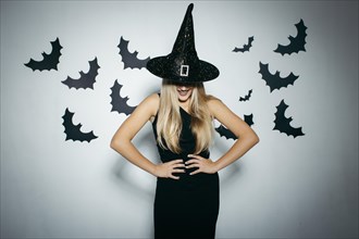 Smiling woman with witch hat