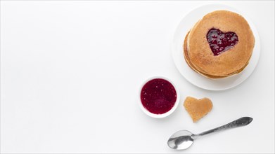 Top view fruit jam with pancakes