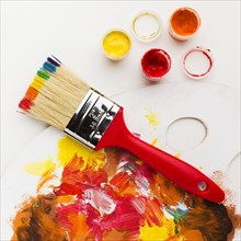 Brush with rainbow paint design