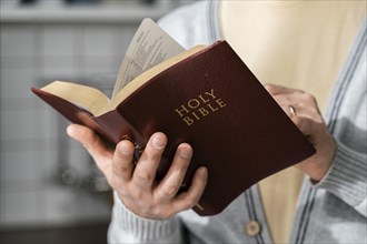 Front view man holding bible