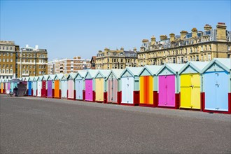 Row of beautiful colourful seaside bathing cottages in Brighton and Hove