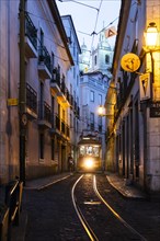 Tram in an alley in the old town of Lisbon