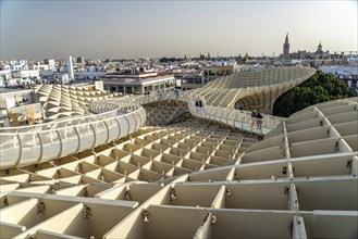 The futuristic wooden construction and observation deck Metropol Parasol and the rooftops of Seville